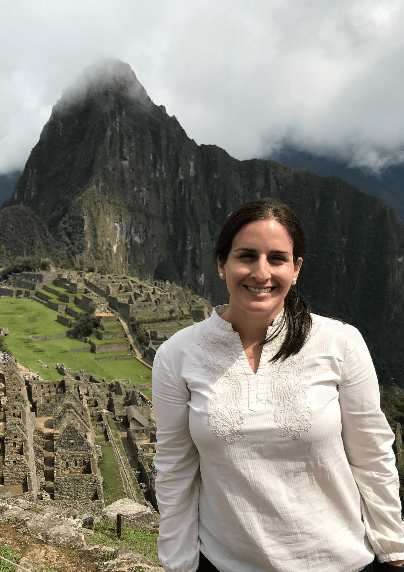 Travel scenery at Machu Picchu: misty mountain peaks and Inca terraces in Peru